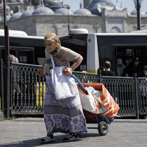 An elderly woman pulls a trolley ahead of the May 28 Turkey's presidential run-off, Istanbul, Turkey, May 22, 2023.